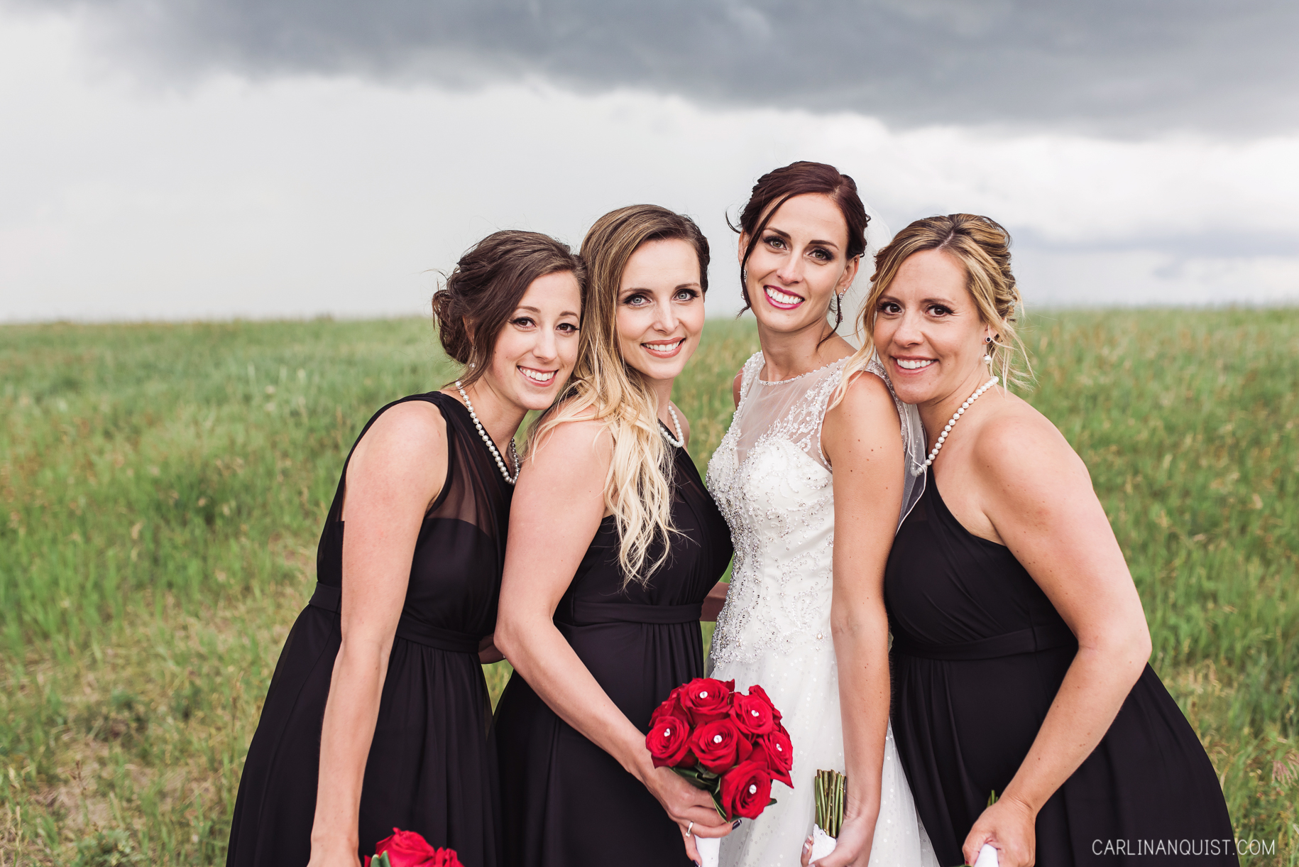 Bride and Bridesmaids | Black Bridesmaids Dresses | Red Bouquets